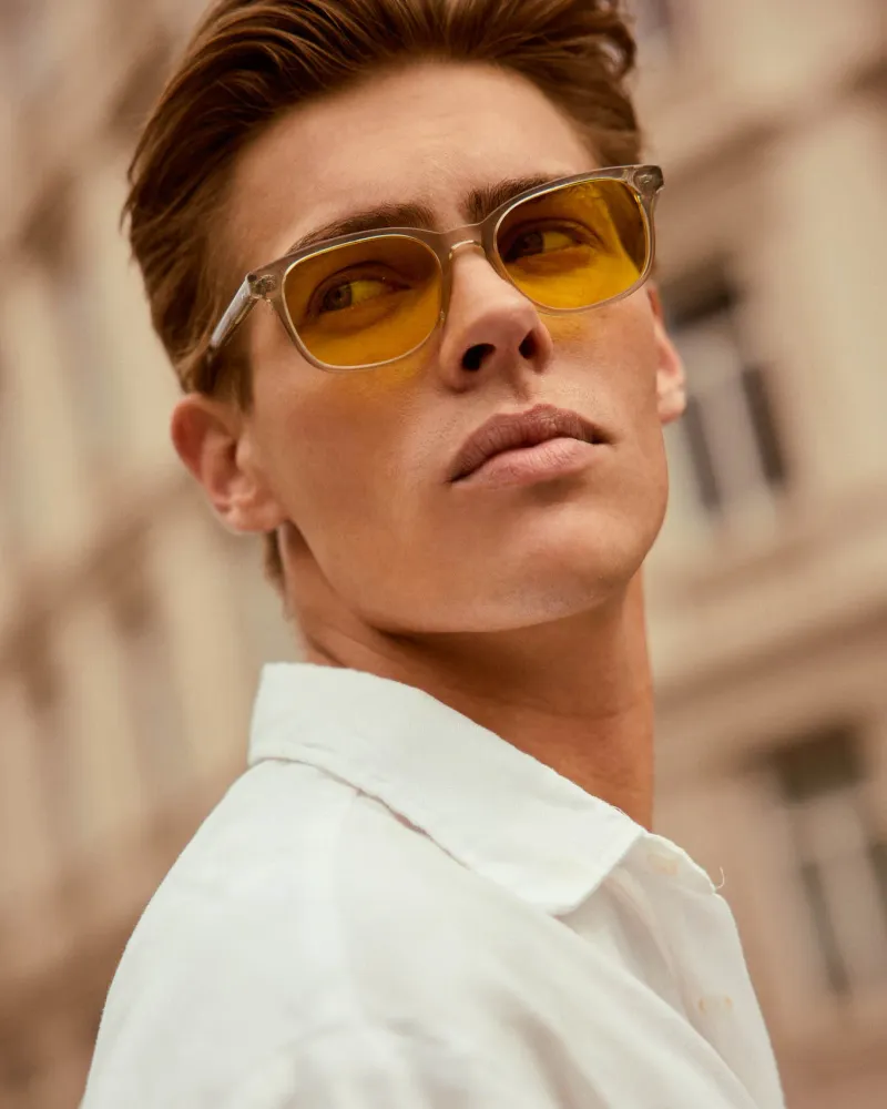 A photo of a man wearing the Filter Optix Cedar Silver Thyme with Yellow lenses.